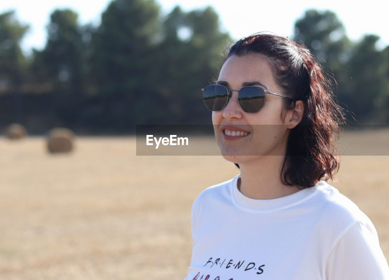 Portrait of young woman wearing sunglasses