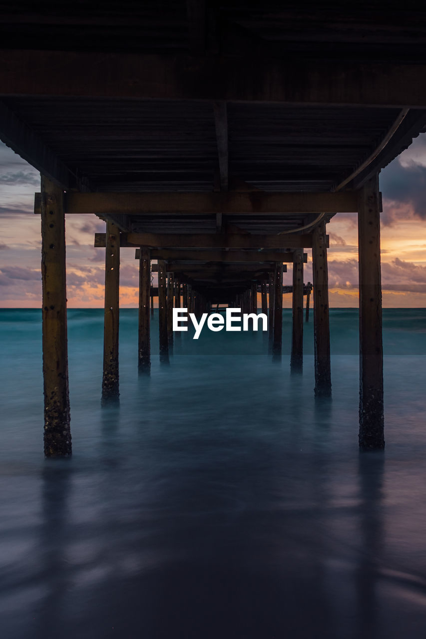 Pier over sea against sky