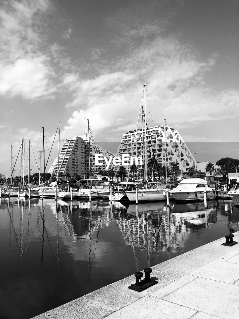 water, sky, black and white, architecture, nautical vessel, harbor, transportation, monochrome, monochrome photography, ship, nature, dock, cloud, built structure, travel destinations, cityscape, city, mode of transportation, pier, vehicle, reflection, building exterior, travel, sailboat, sea, outdoors, day, tourism, marina, moored, no people, building, watercraft