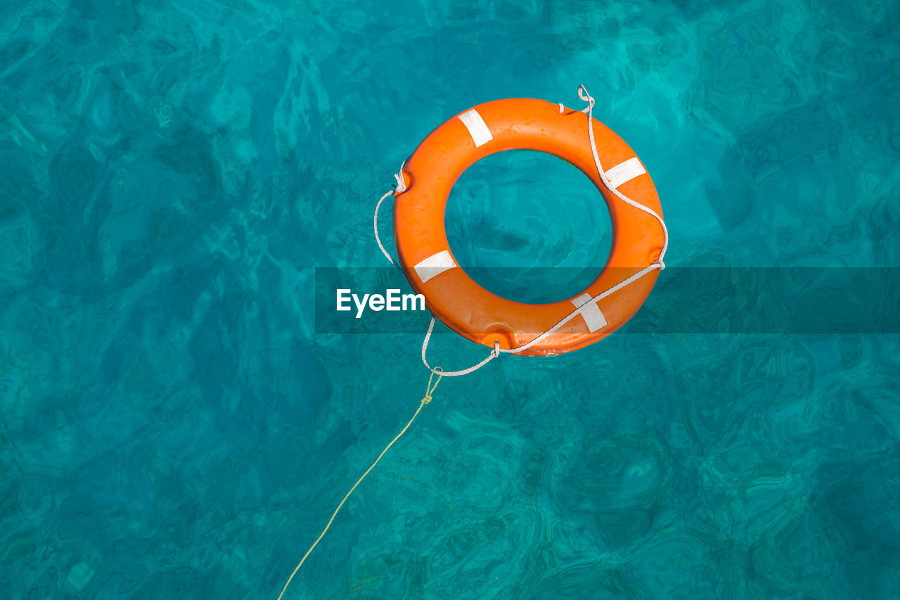 High angle view of life belt on swimming pool