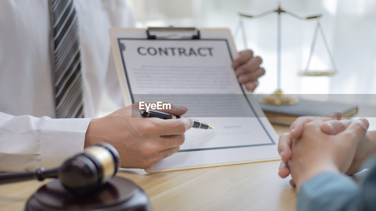 adult, business, indoors, men, table, pen, holding, occupation, communication, writing, selective focus, hand, office, businessman, document, paper, furniture, one person, business finance and industry, working, planning, women, desk, close-up, text, corporate business, finance, person