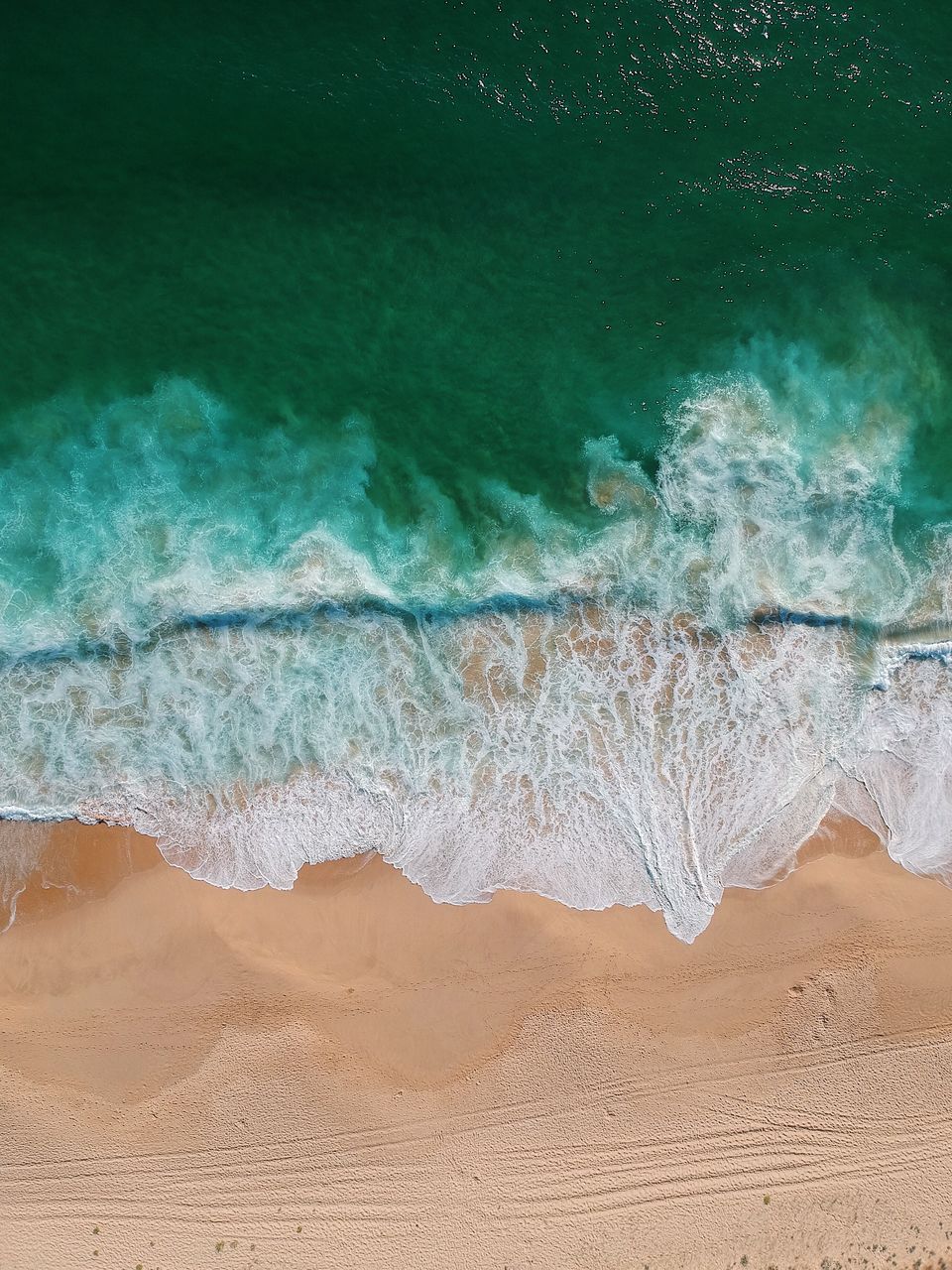 Aerial view of waves at beach