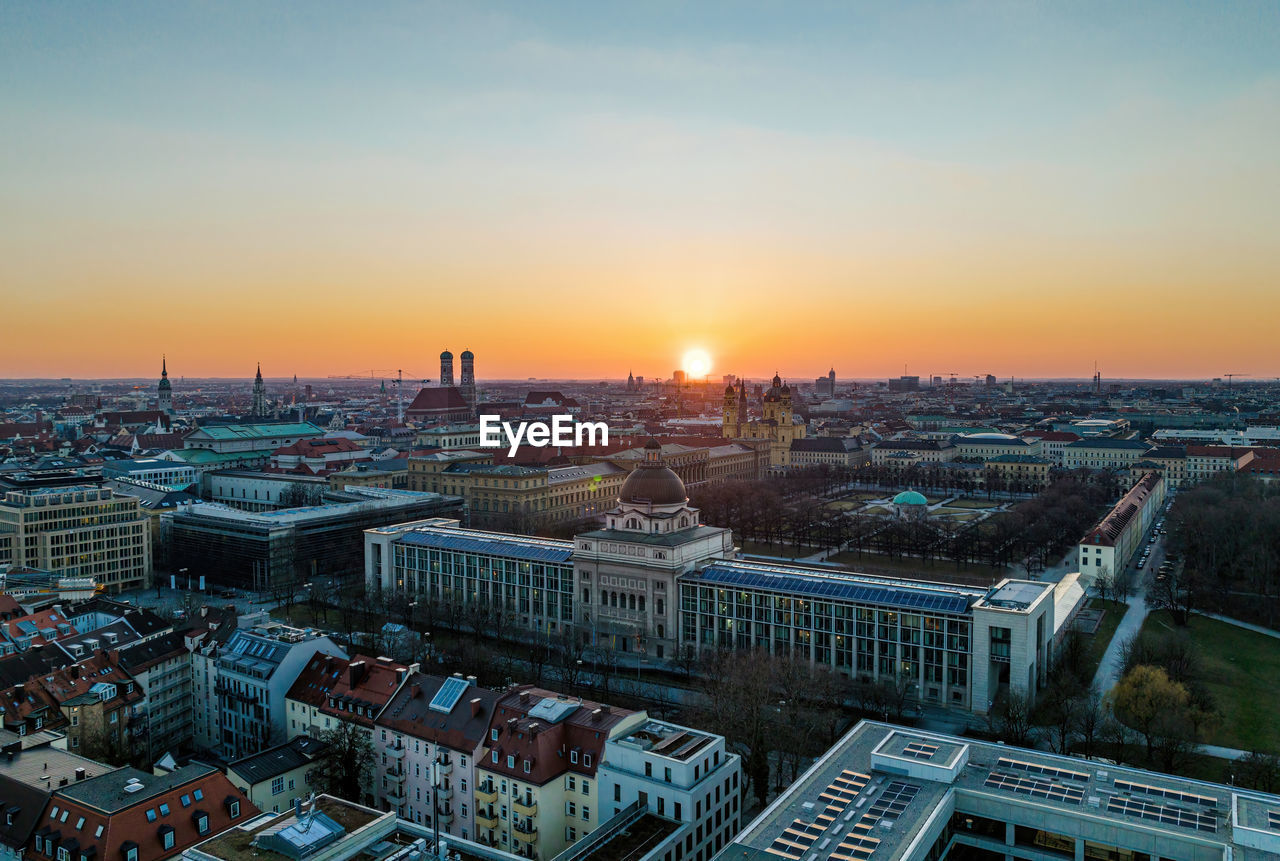 Sun setting behind the state chancellory in munich, germany