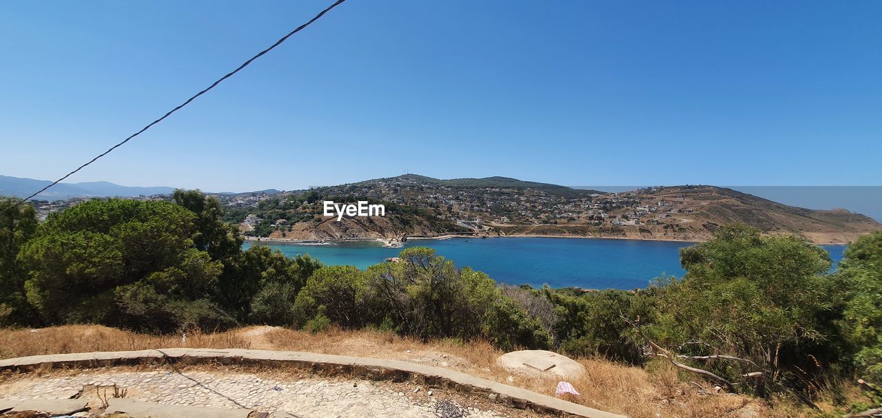 SCENIC VIEW OF BAY AGAINST CLEAR SKY