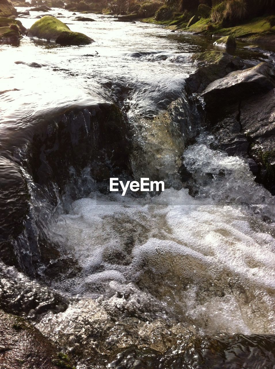 WATER FLOWING THROUGH ROCKS