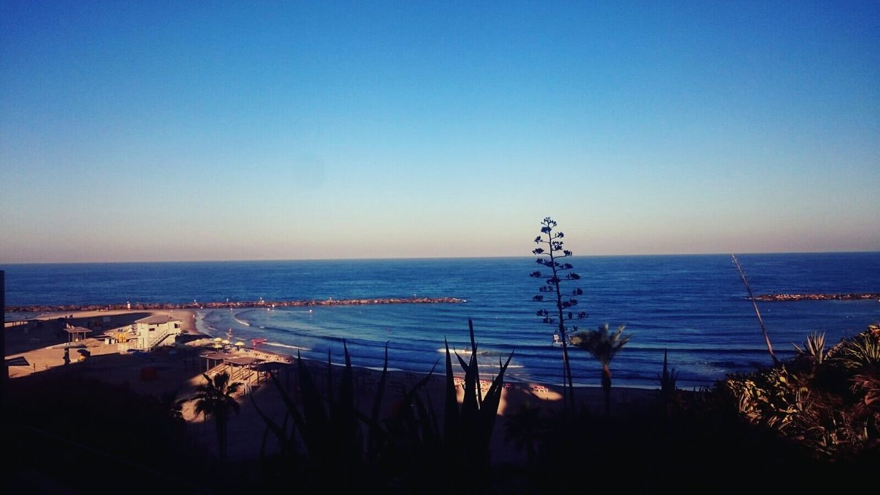 PANORAMIC VIEW OF CALM BLUE SEA AT DUSK