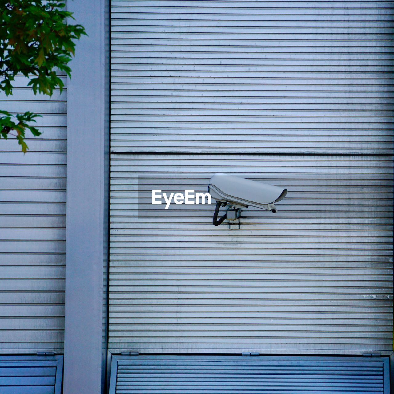 Security camera on the wall of the building