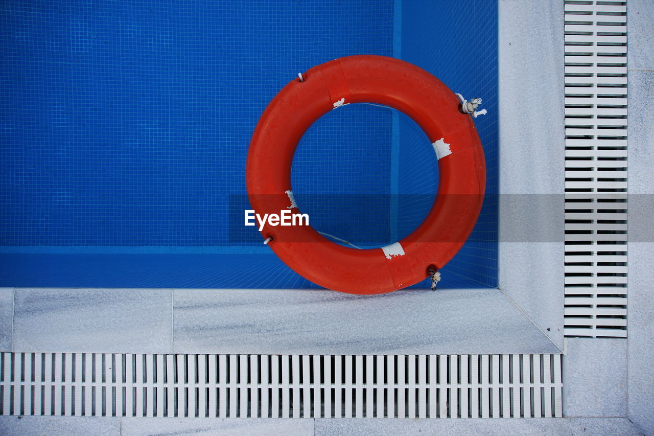 Directly above shot of life belt floating on swimming pool