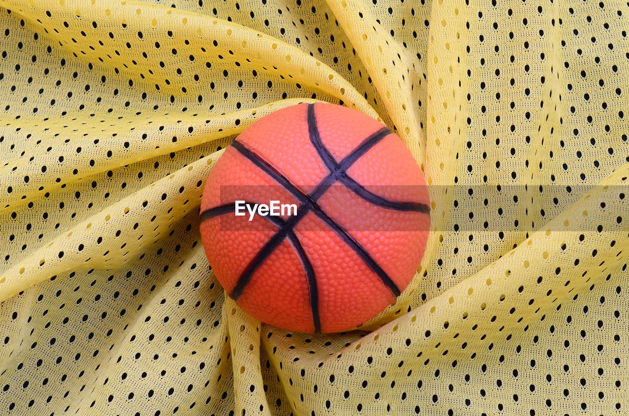 High angle view of basketball on fabric