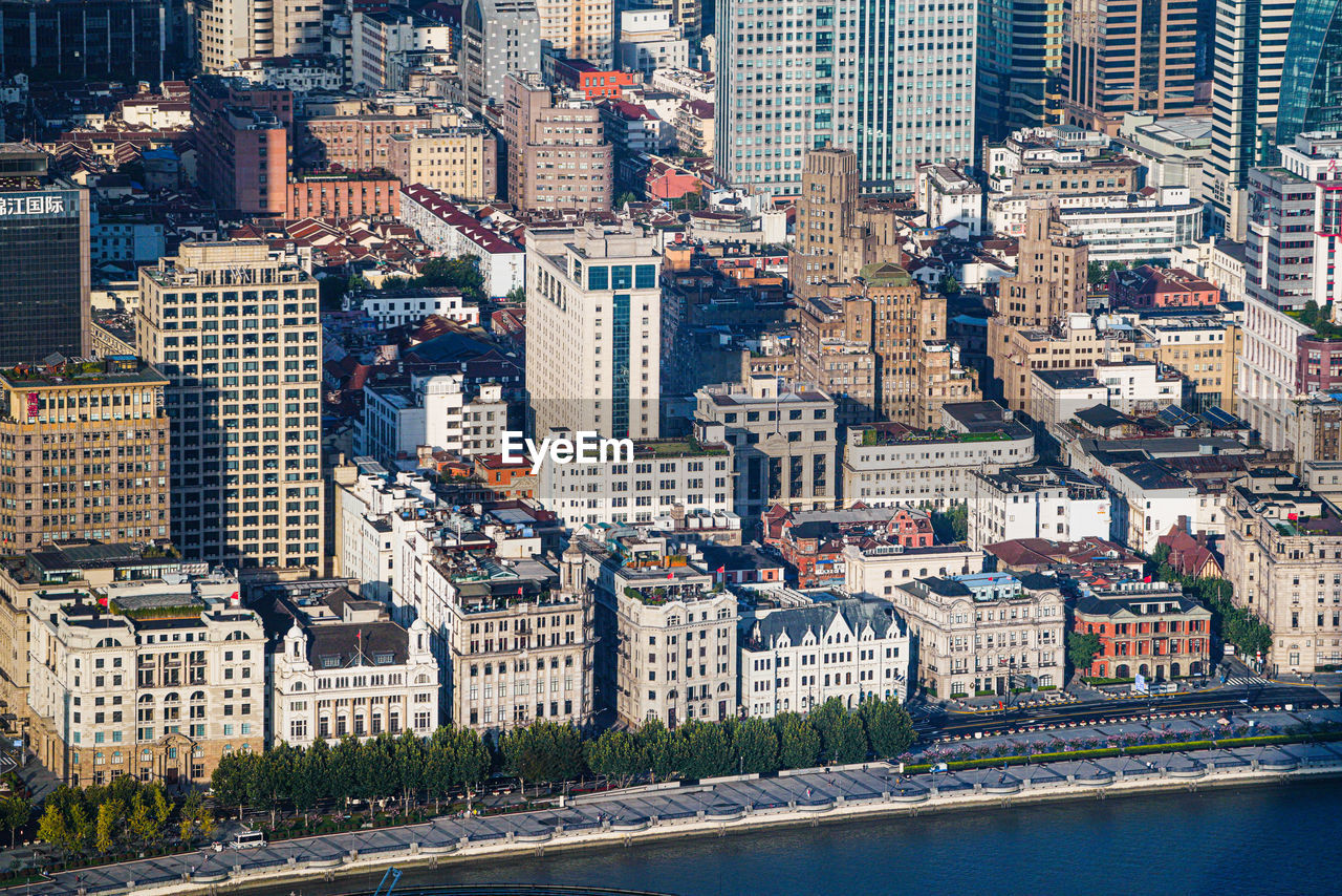 HIGH ANGLE VIEW OF BUILDINGS AND CITY IN BACKGROUND