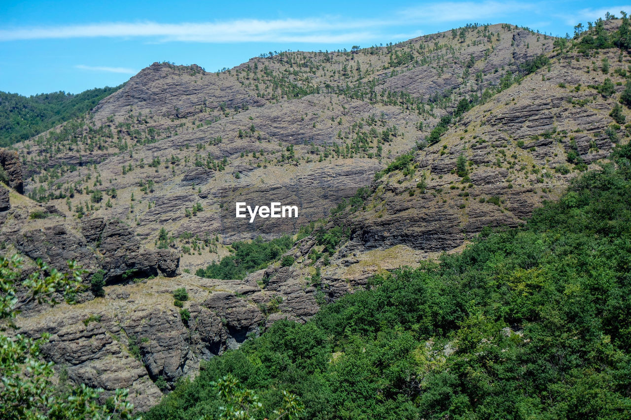 Scenic view of rocky mountains against sky