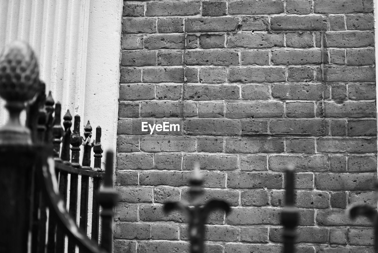 Gate against brick wall