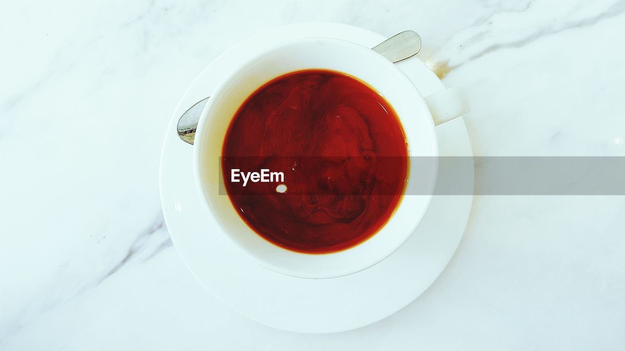 High angle view of fresh coffee in cup on table