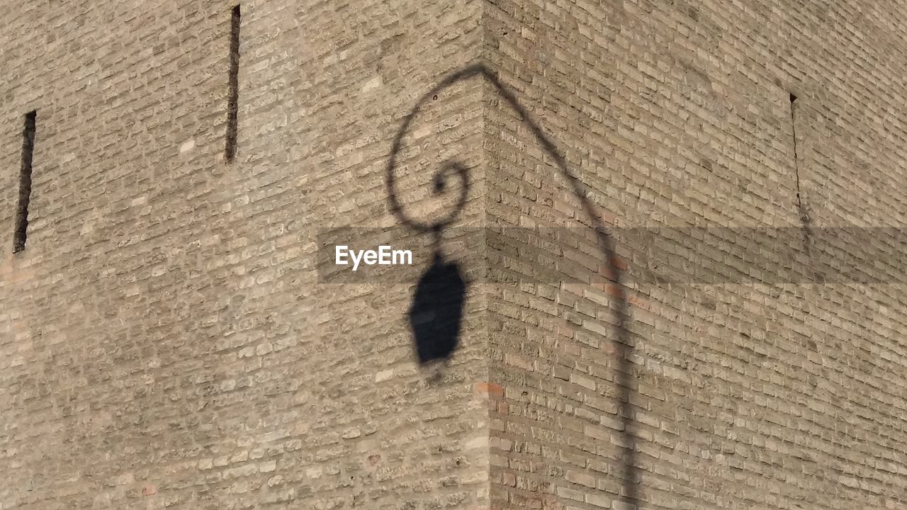 CLOSE-UP OF SHADOW ON WALL