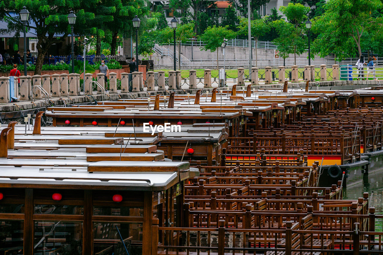 Row of anchored bum boats on singapore river.