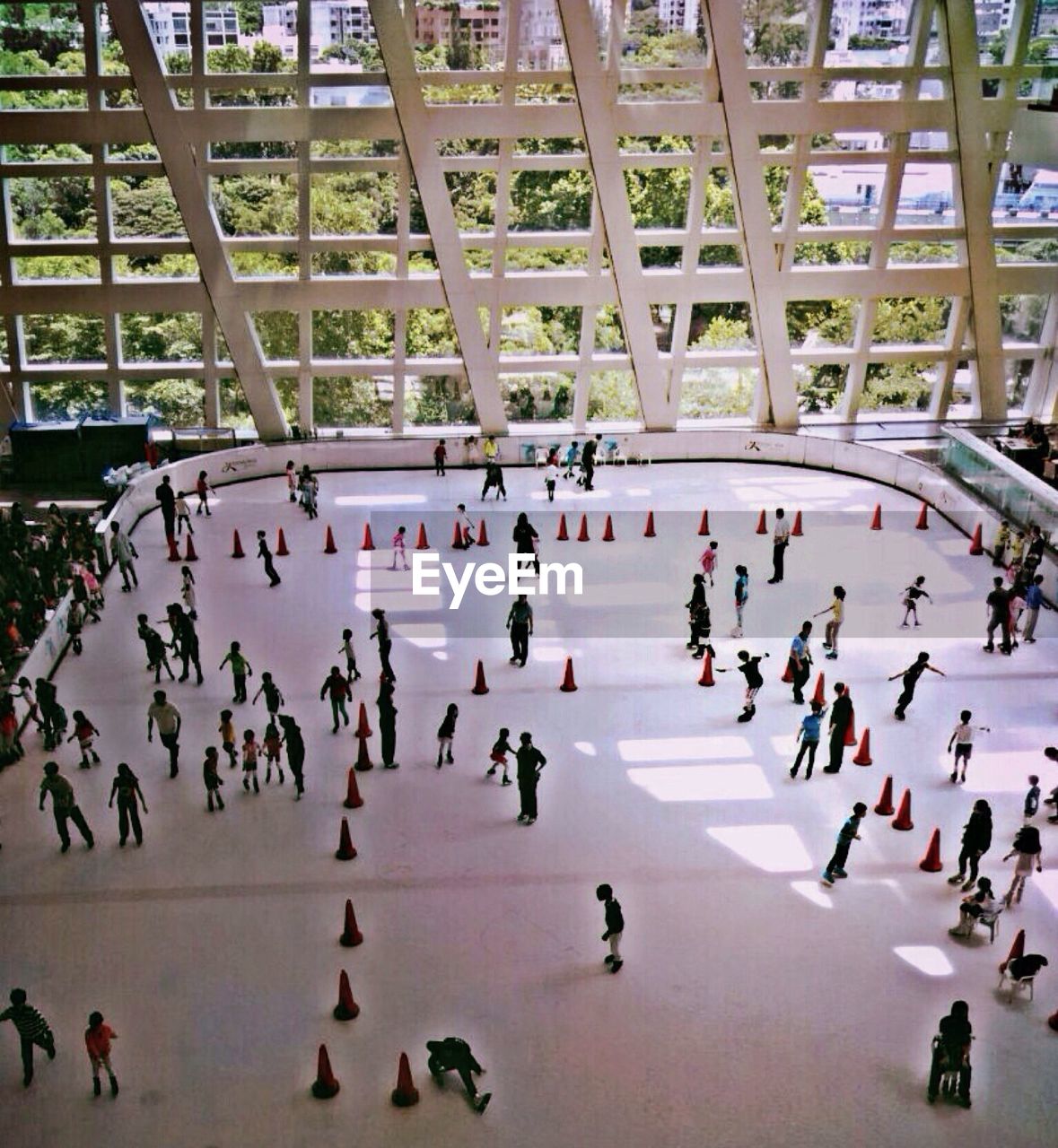 High angle view of people ice-skating on rink