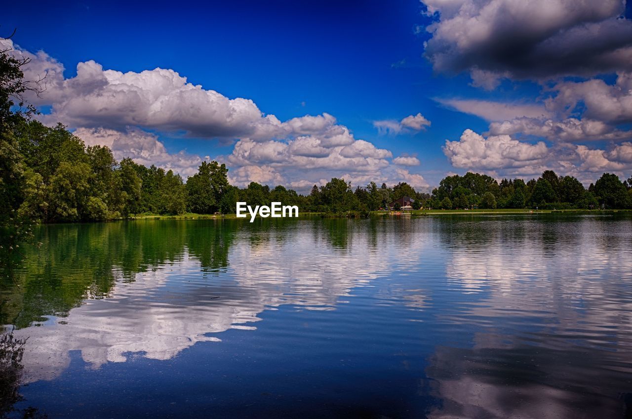 SCENIC VIEW OF LAKE BY TREES AGAINST SKY