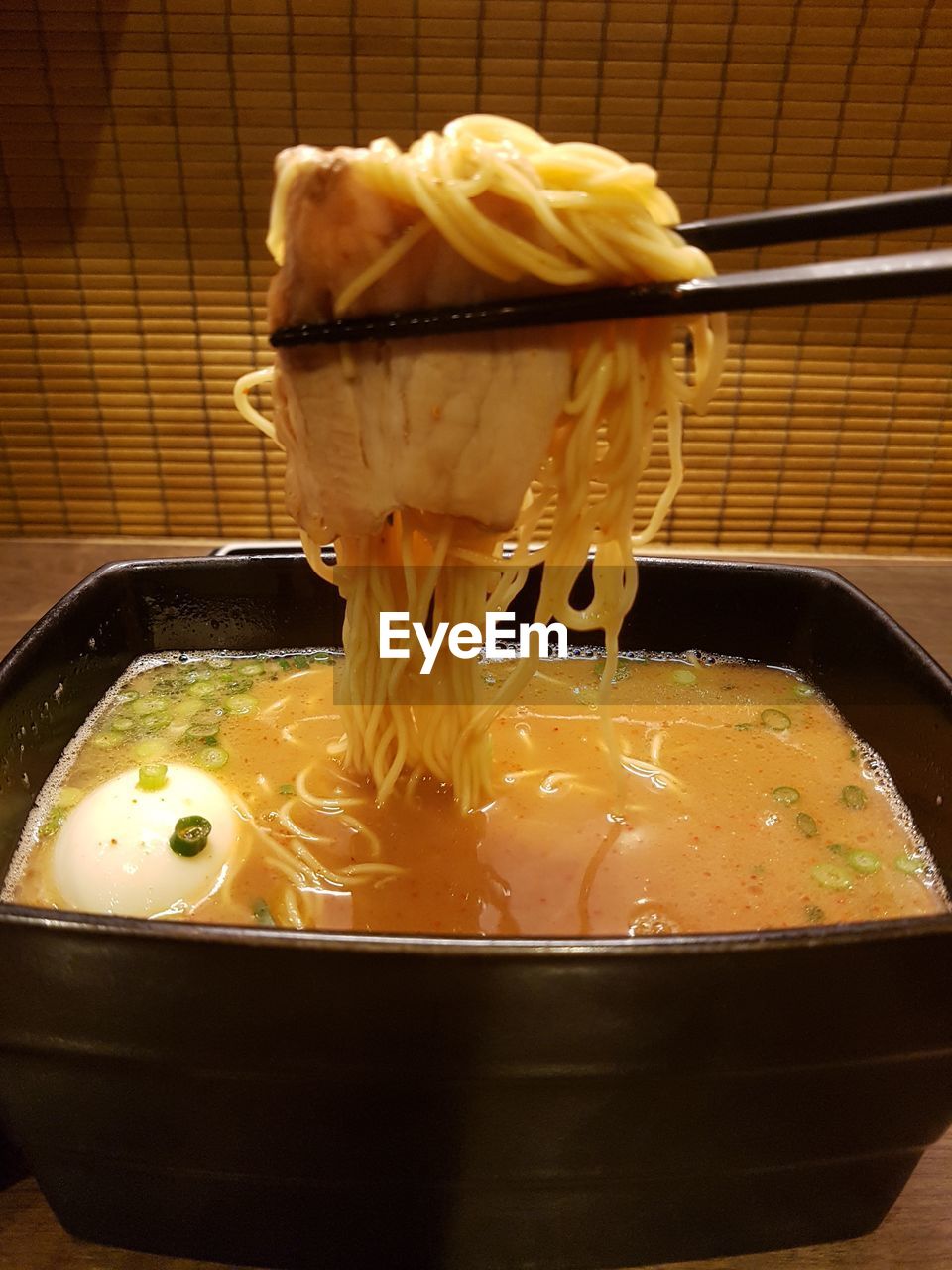 CLOSE-UP OF SOUP IN BOWL ON TABLE