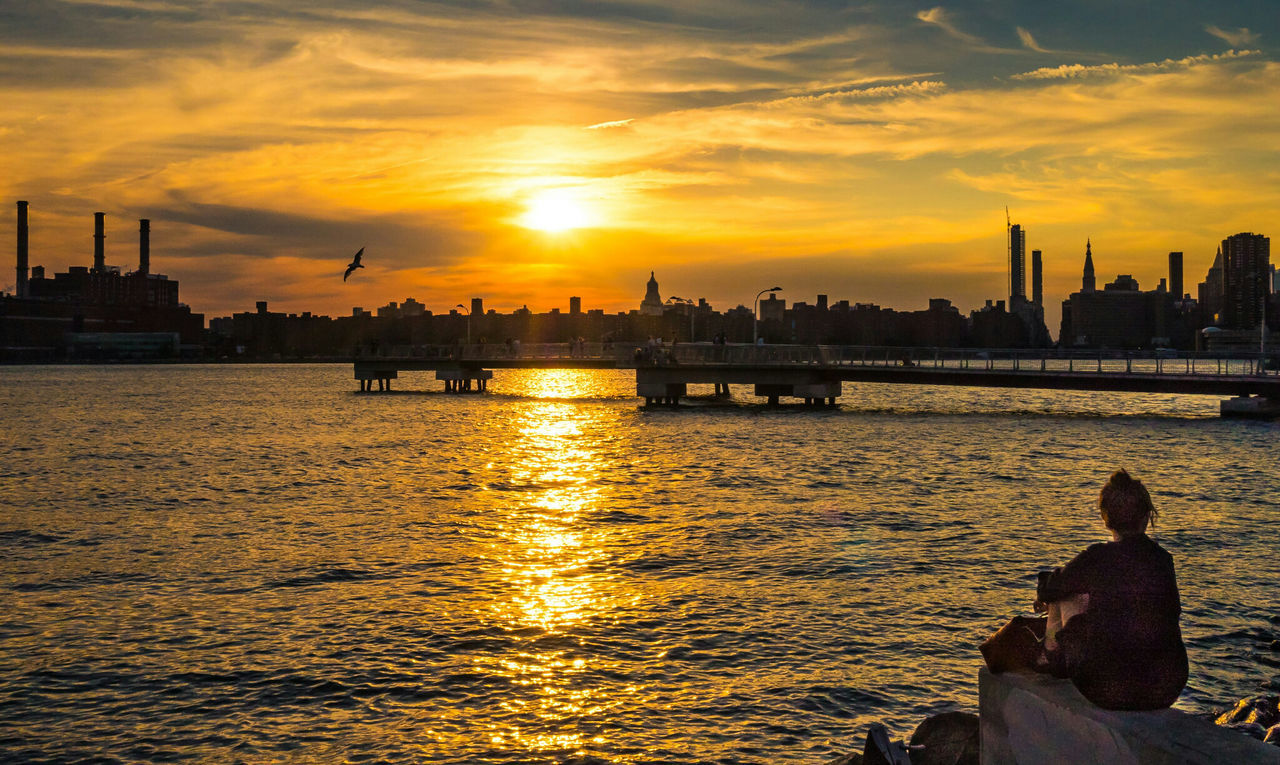 Silhouette of city at sunset