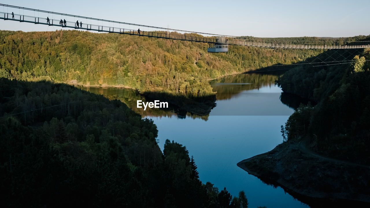 Scenic view of bridge over river against sky