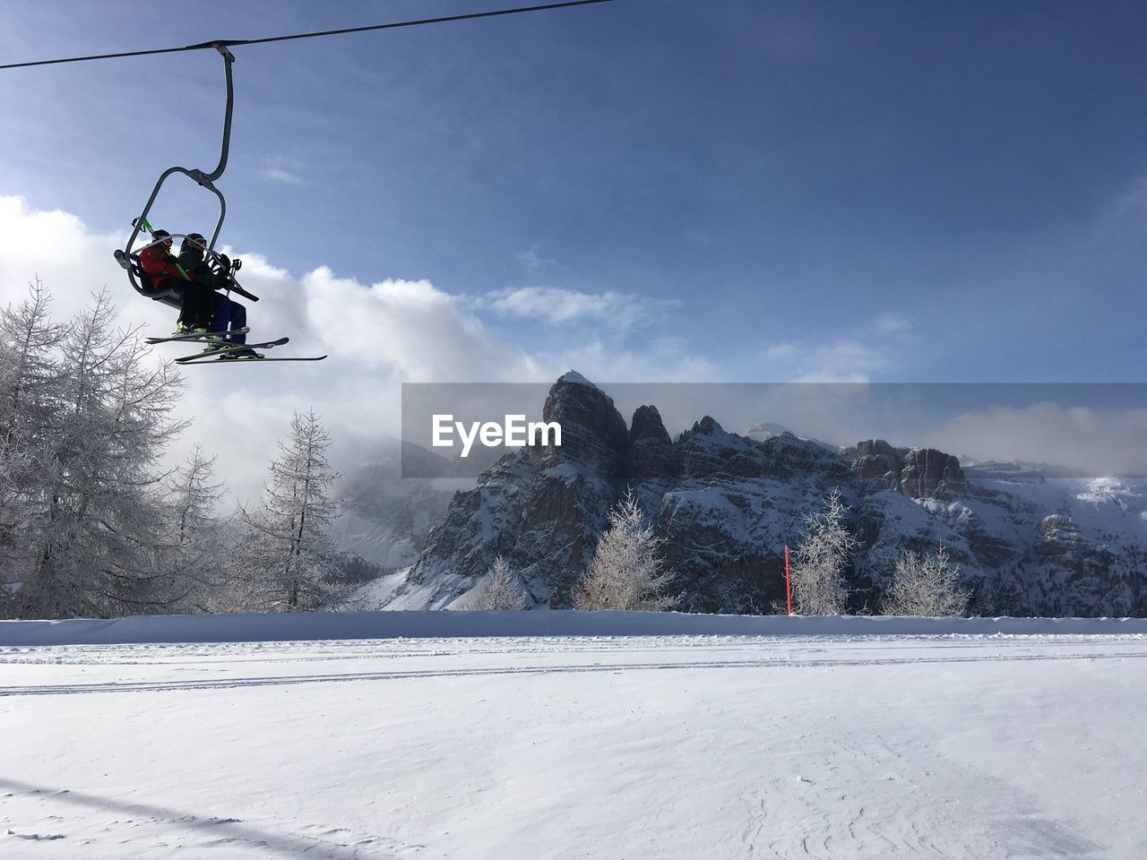 SKI LIFT ON SNOW COVERED MOUNTAIN