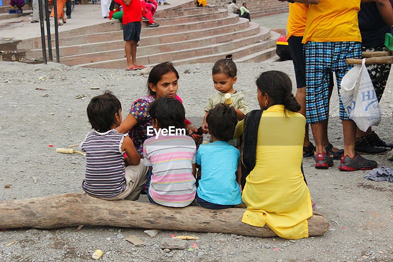 CHILDREN WITH UMBRELLA