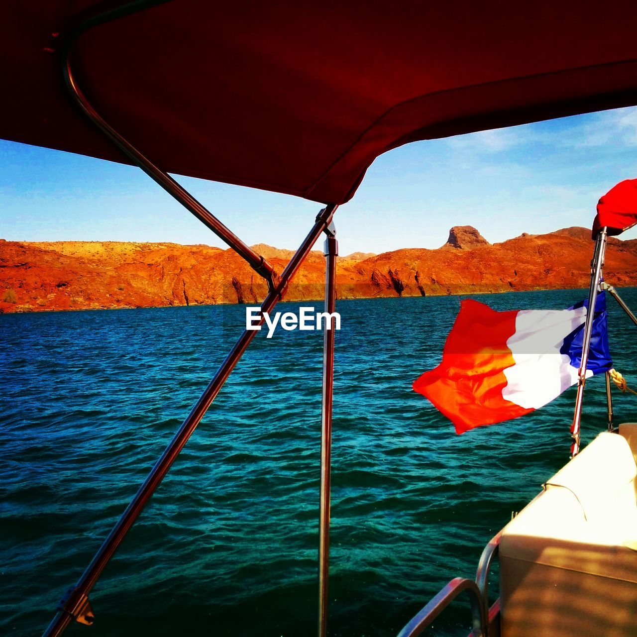 Cropped image of boat sailing in sea