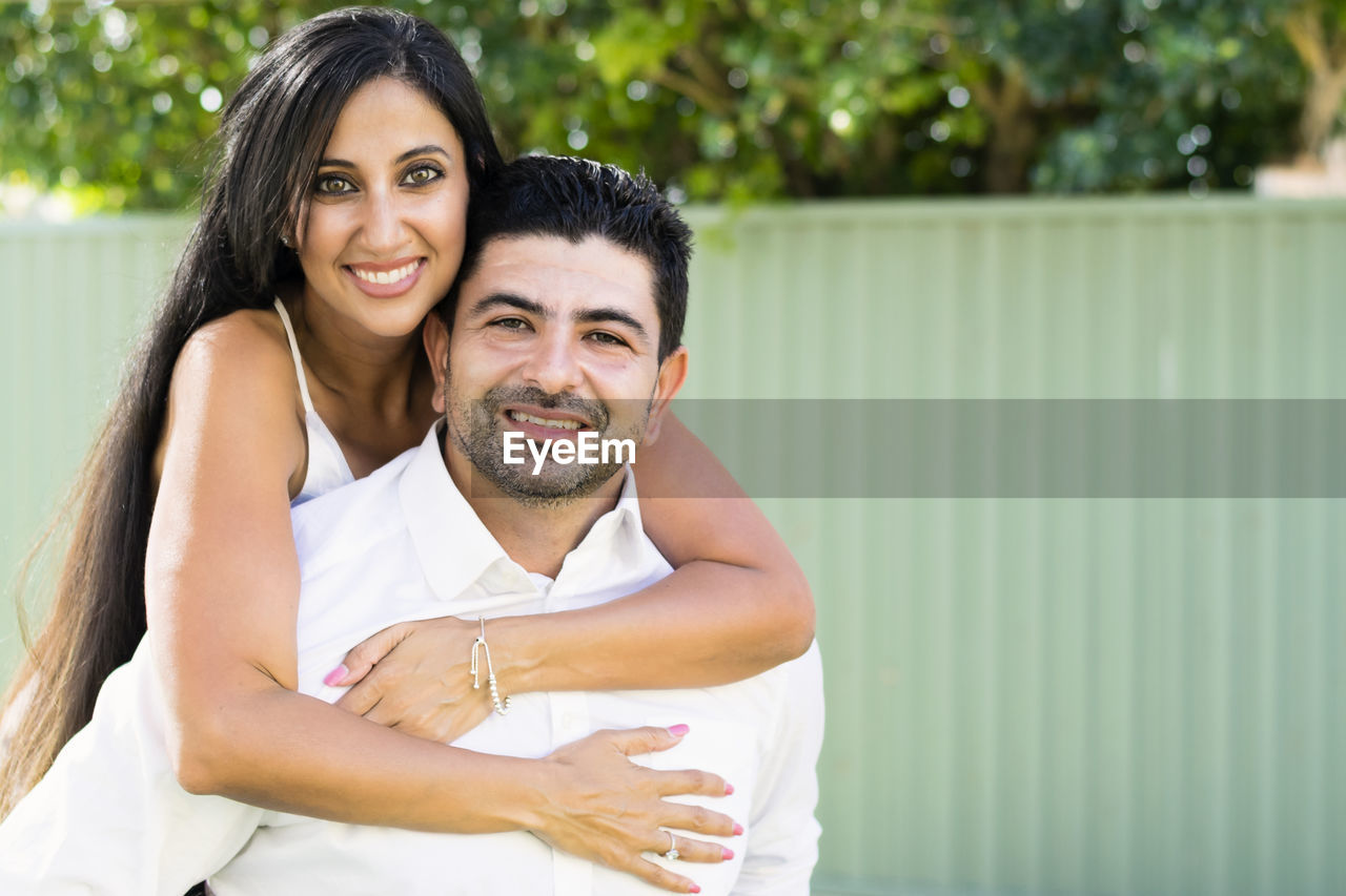 Portrait of smiling couple embracing