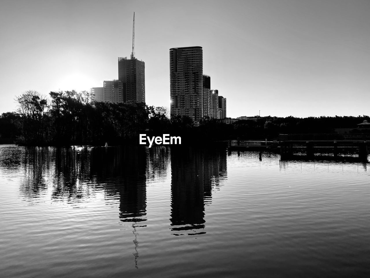 Reflection of buildings in lake against sky