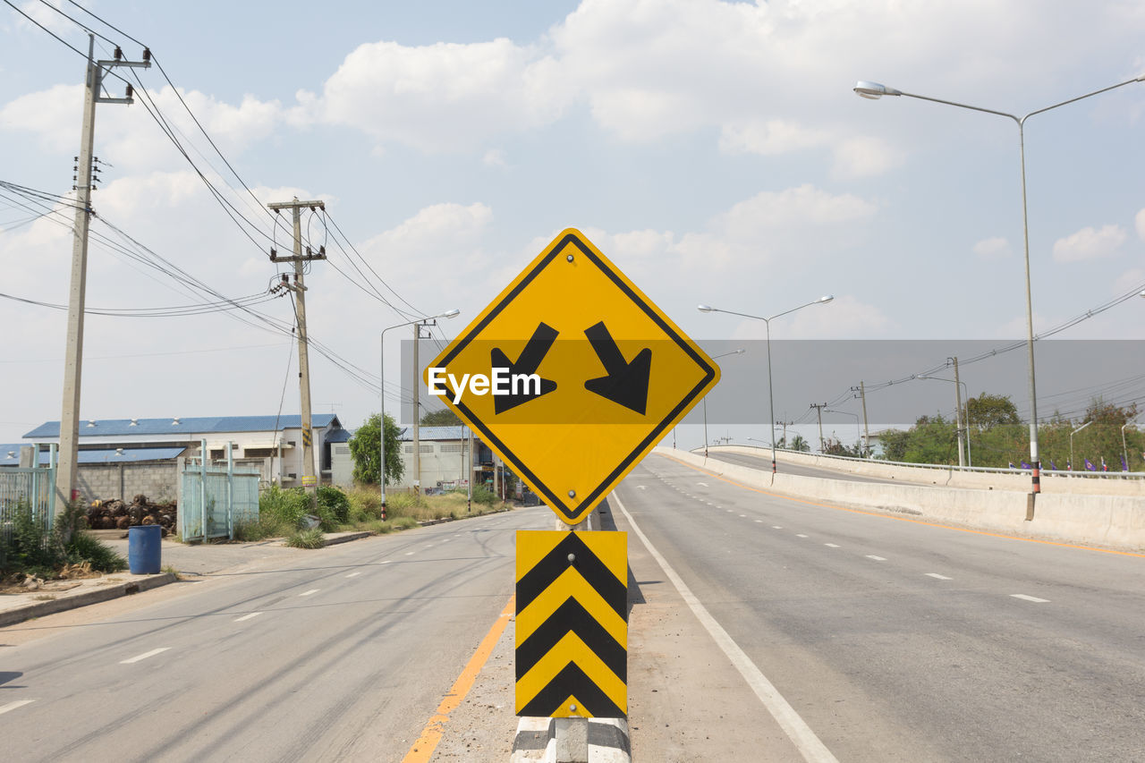 low angle view of road sign against sky