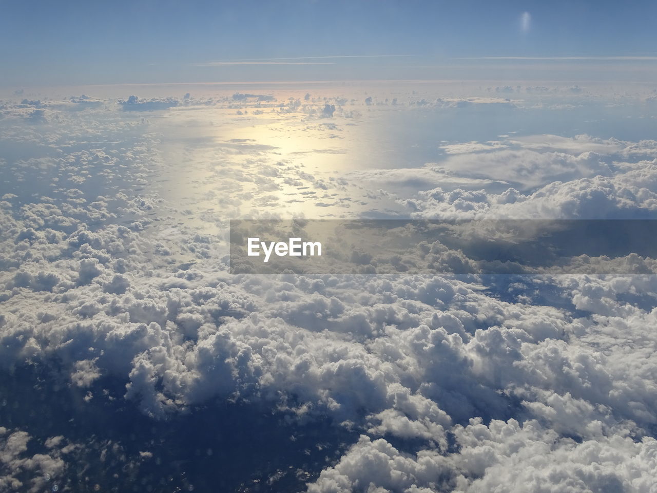 AERIAL VIEW OF CLOUDS OVER LANDSCAPE