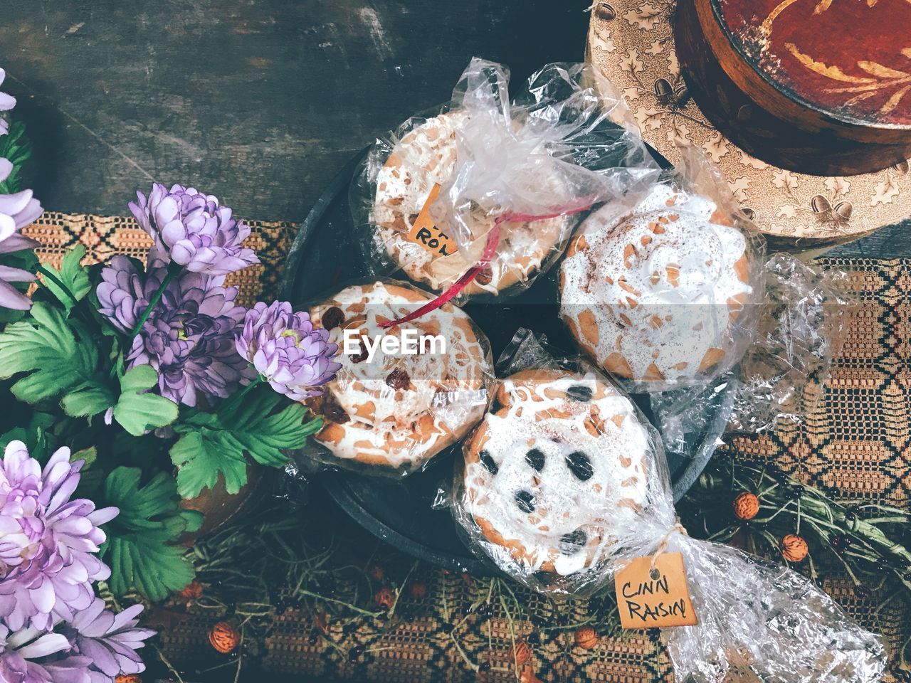 HIGH ANGLE VIEW OF VARIOUS FLOWERS IN PLASTIC