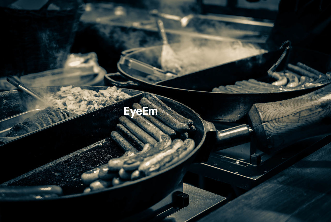 Food cooking in pans on stove