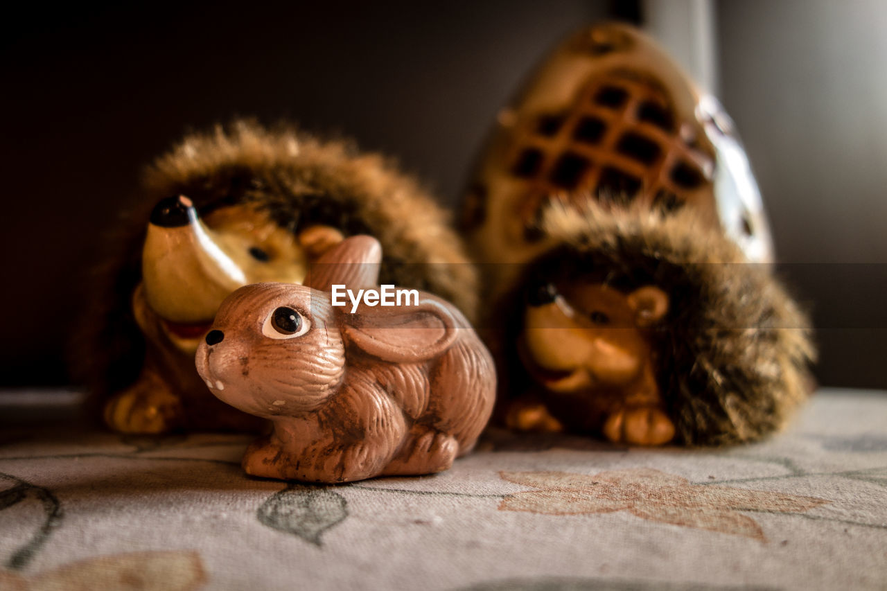 CLOSE-UP OF A STUFFED TOY ON TABLE