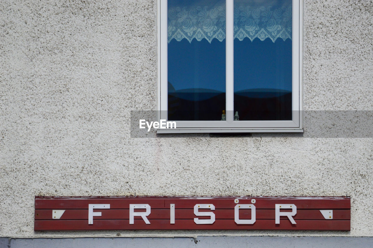 CLOSE-UP OF WINDOW ON WALL