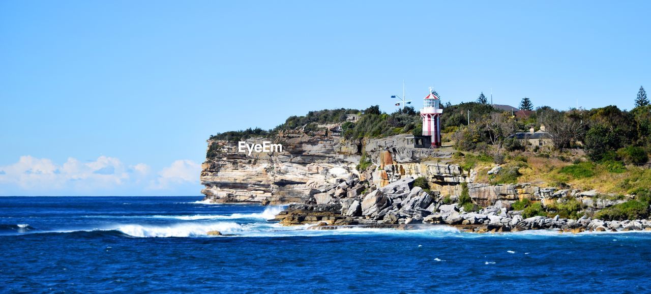 Scenic view of sea against clear blue sky