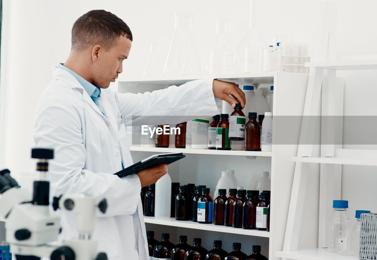 Side view of man working in laboratory