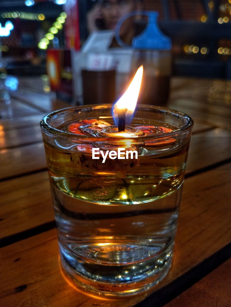 burning, flame, candle, fire, illuminated, old fashioned glass, alcoholic beverage, lighting, heat, glass, food and drink, focus on foreground, table, drinking glass, distilled beverage, close-up, no people, drink, wood, nature, indoors, refreshment, household equipment, night, alcohol
