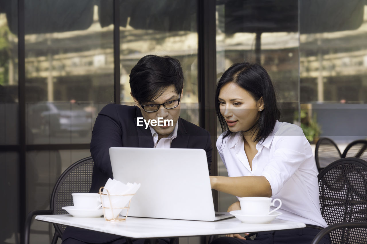 Friends working at table