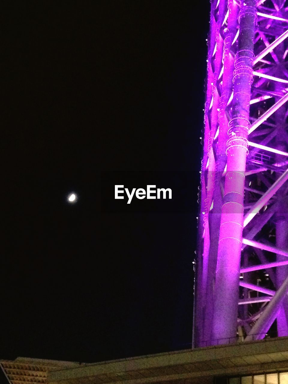 LOW ANGLE VIEW OF ILLUMINATED LAMP POST