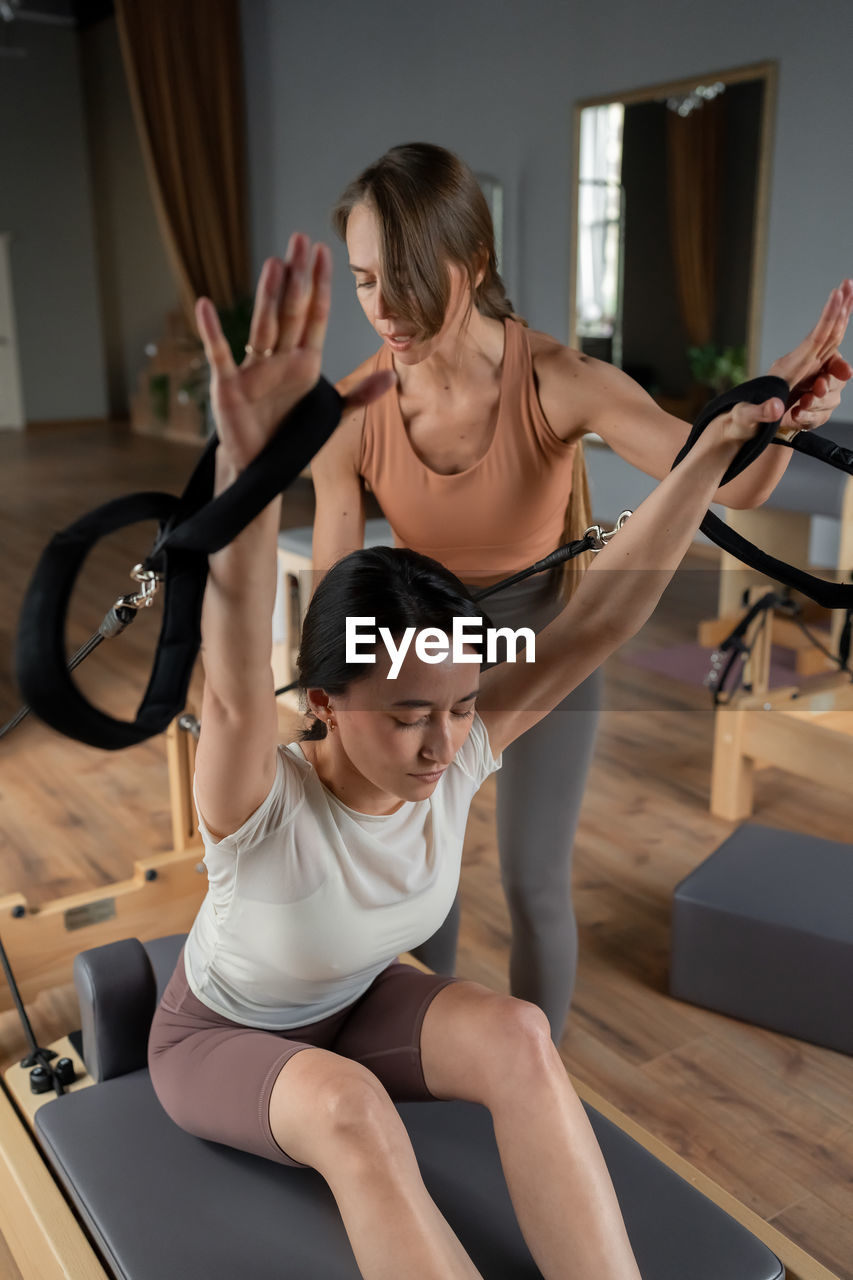 Modern pilates studio with bright, spacious windows for exercise and wellbeing
