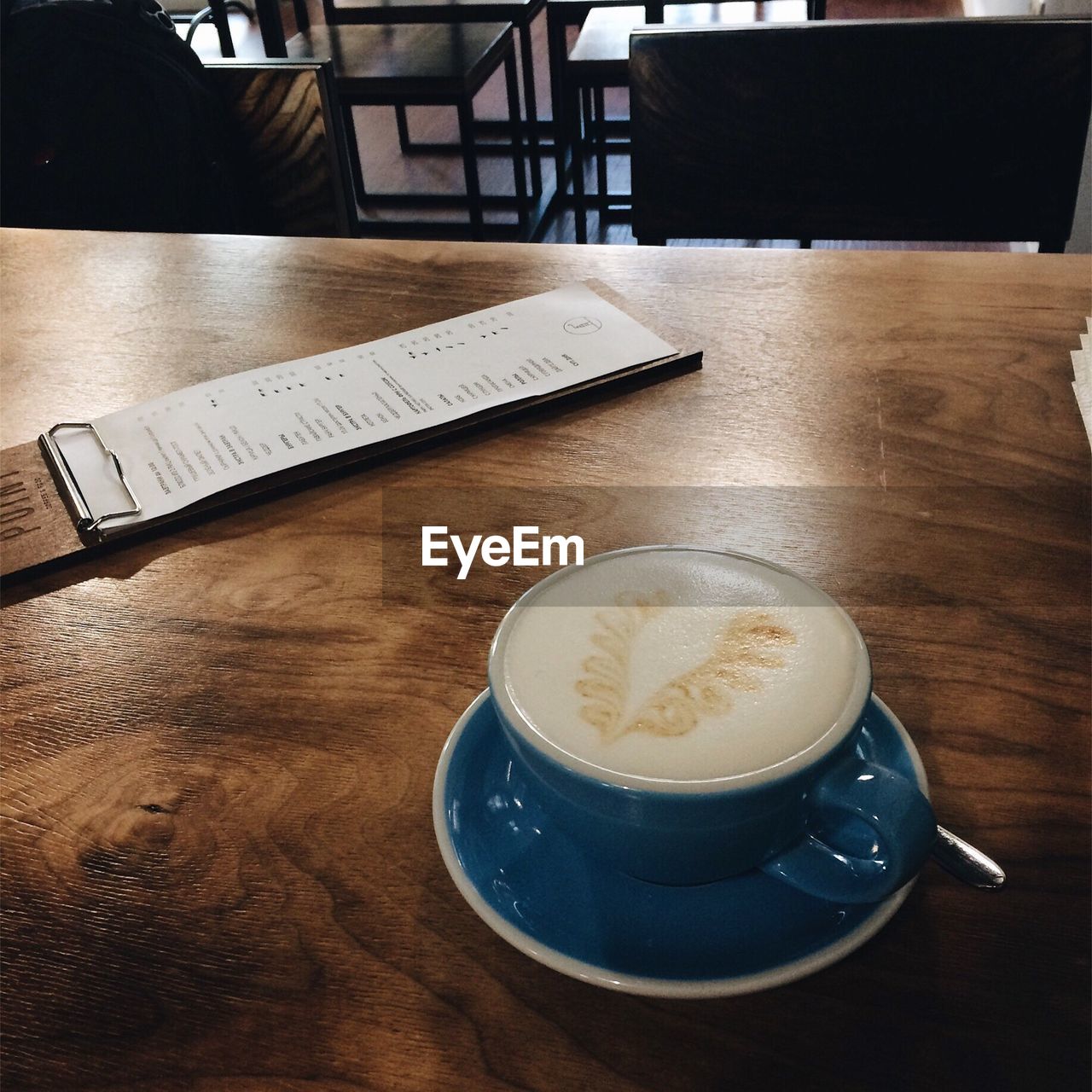 CLOSE-UP OF COFFEE ON TABLE AT HOME