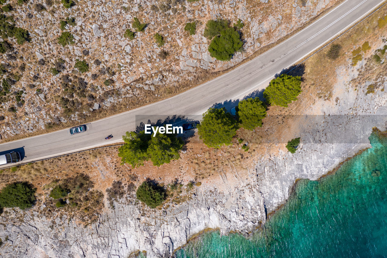 HIGH ANGLE VIEW OF ROAD BY LAND