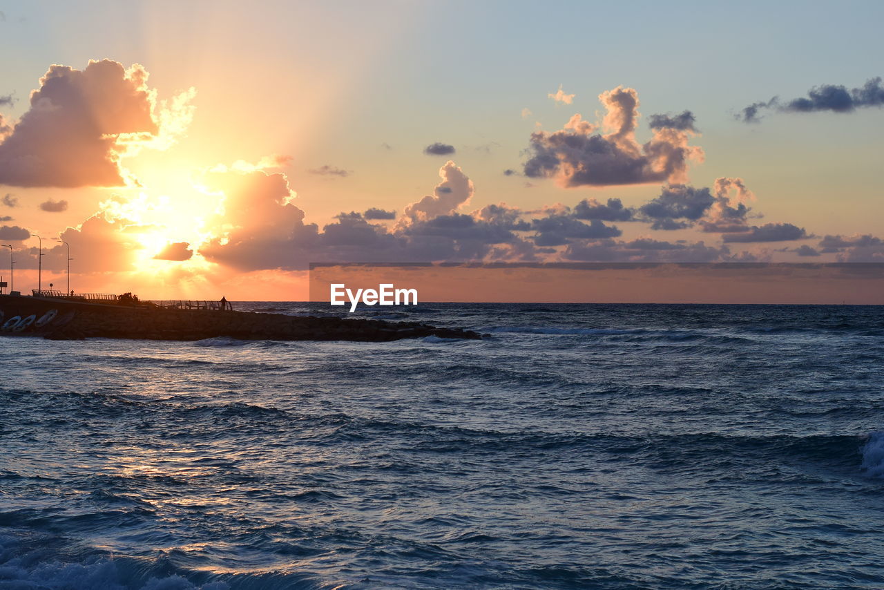 Scenic view of sea against sky during sunset