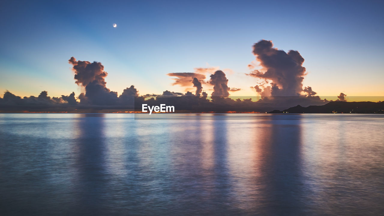 Scenic view of sea against sky at night