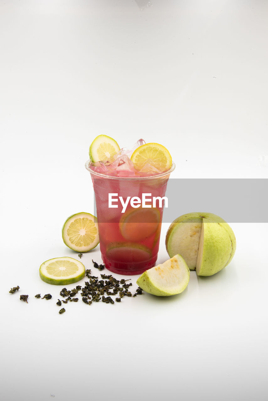 high angle view of fruits in glass on white background