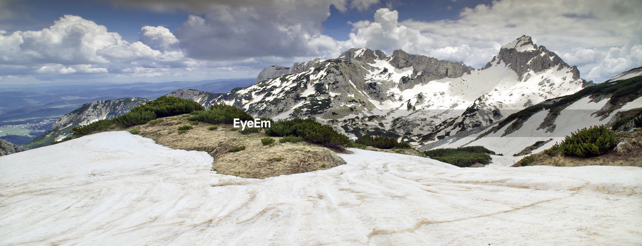 Scenic view of snowcapped mountains against sky