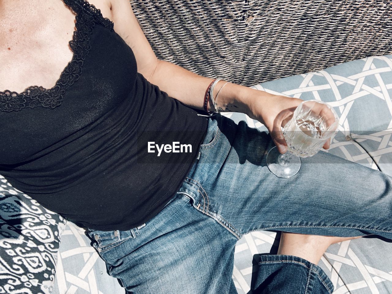High angle view of woman drinking glass
