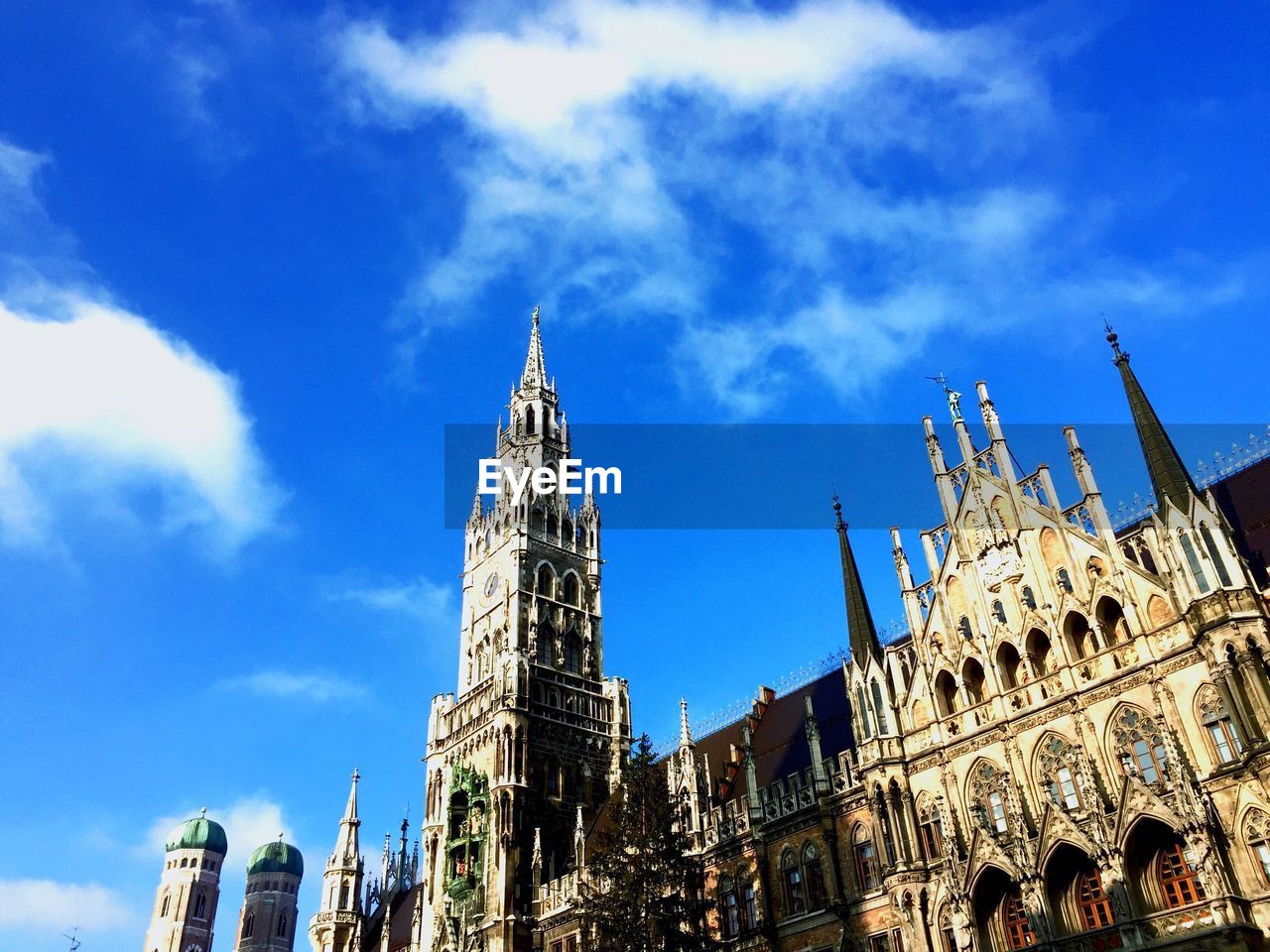 Low angle view of church against cloudy sky