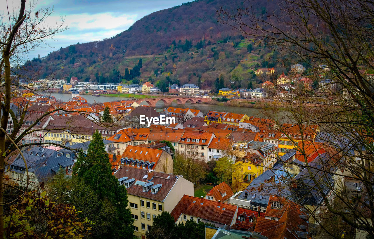 Houses in town against sky during autumn